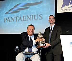 Nick Craig is presented the trophy by Geoff Holt MBE