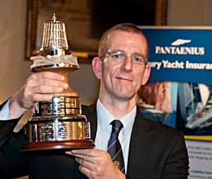 Nick Craig is presented the trophy by Geoff Holt MBE