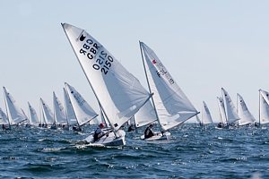 Nick Craig leads the Fleet of OK dinghies in race 2