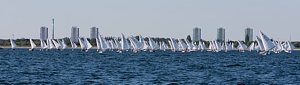 The fleet of OK dinghies downwind